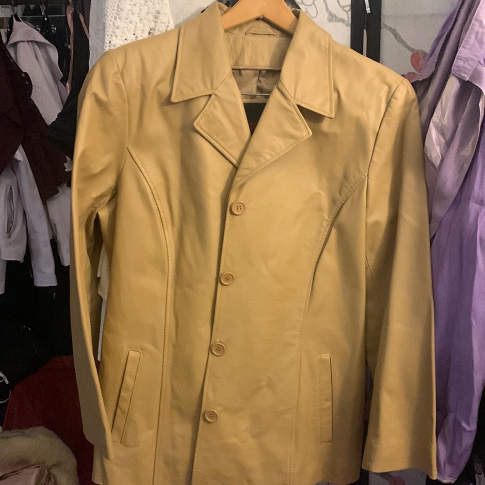 Tan vintage 1970s leather genuine leather jacket.
